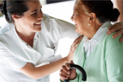 nurse and elderly woman talking
